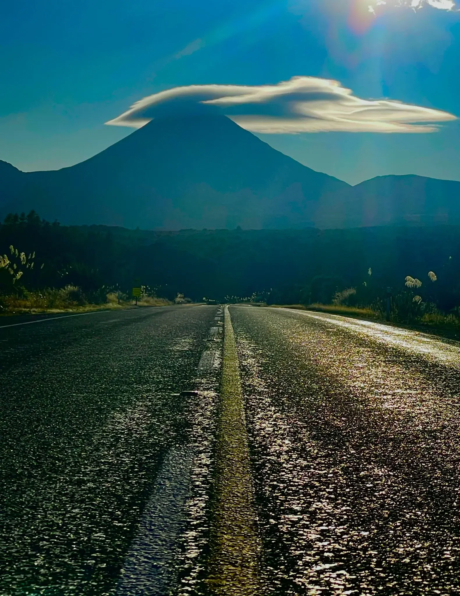 Open road through a natural landscape